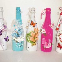 original design of glass bottles with decorative ribbons photo