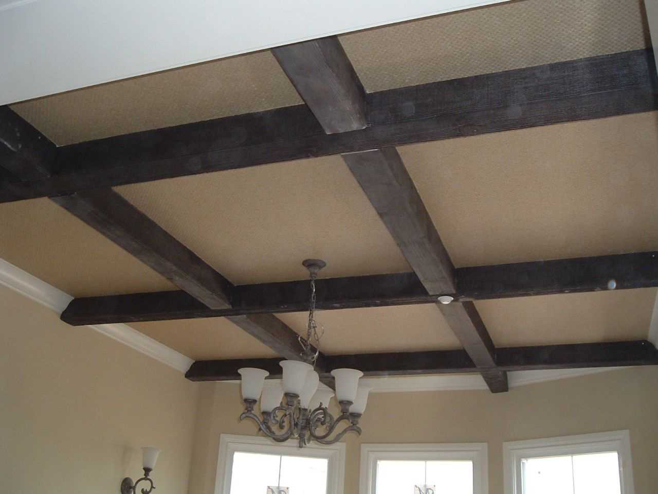 the idea of ​​a beautiful living room design with decorative beams