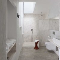 version of the bright interior of a white bathroom photo