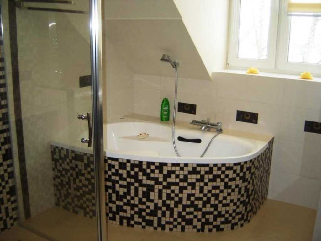 variant of the bright interior of the bathroom with a corner bath