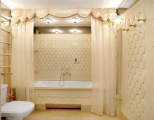 version of the unusual interior of the bathroom in beige color photo