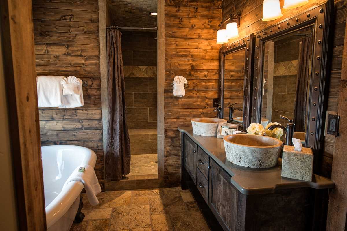 version of the modern bathroom interior in a wooden house