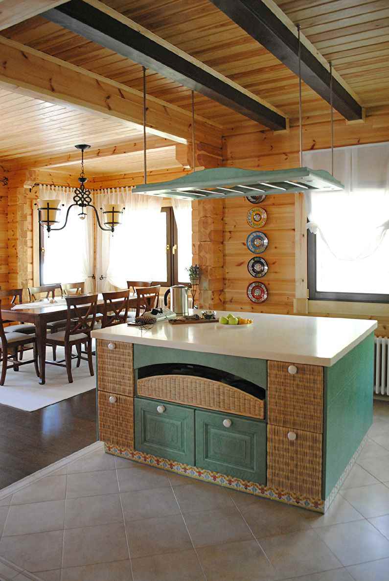 the idea of ​​a bright decor of the kitchen in a wooden house