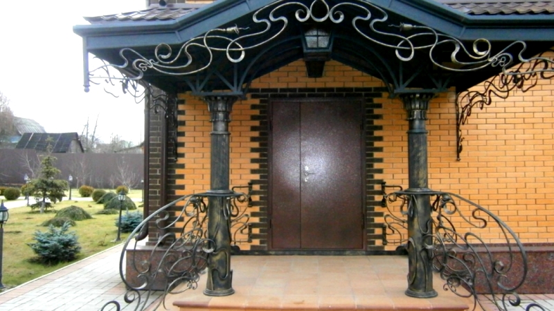 porch with wrought iron railing