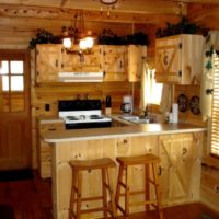 an example of a bright kitchen decor in a wooden house photo
