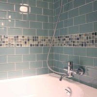 An example of a bright interior laying tiles in the bathroom photo