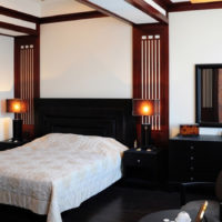 small bedroom with black bed