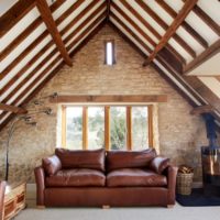 attic design in a house with a sofa