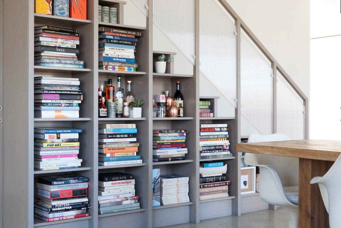 shelves for books under the stairs