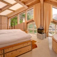bedroom in a wooden house on the attic