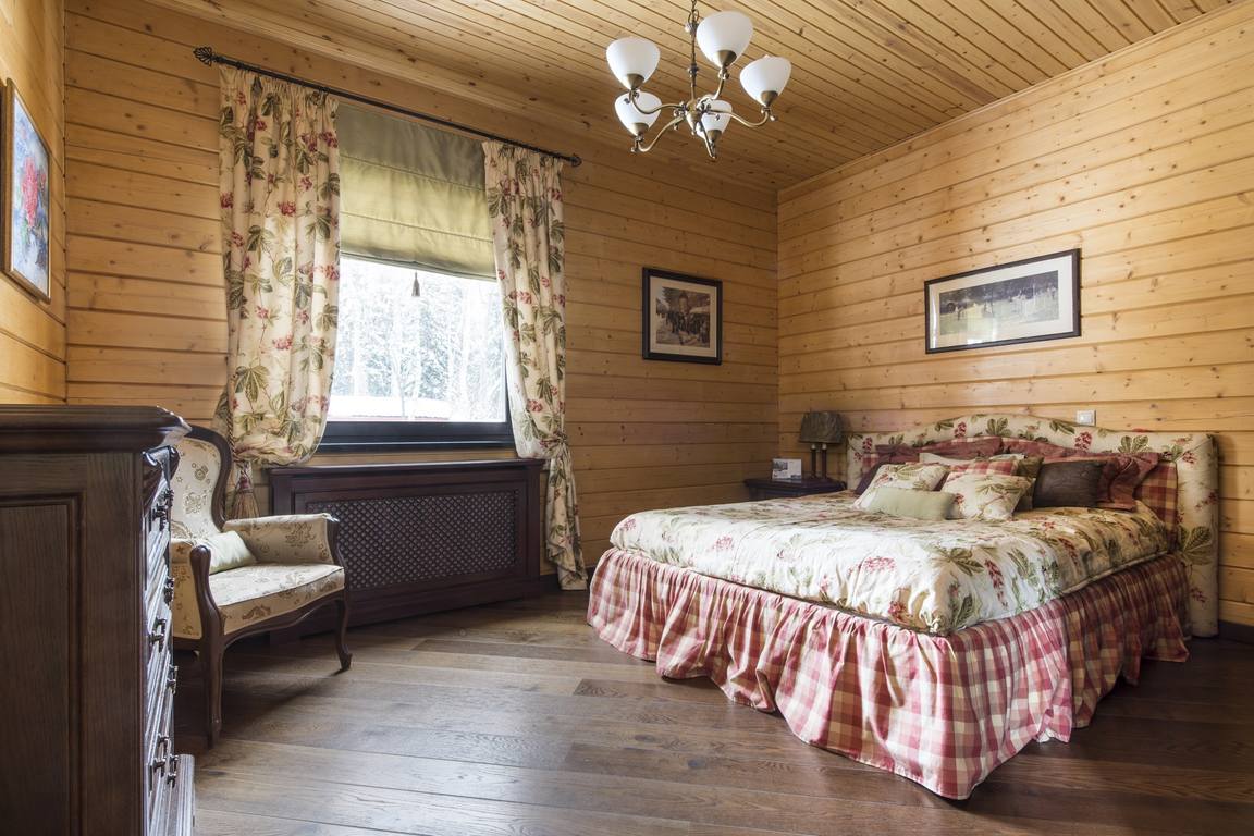 photo of a bedroom in a wooden house