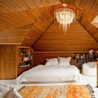 spacious bedroom in a wooden house