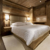 bedroom in a wooden house spot lighting