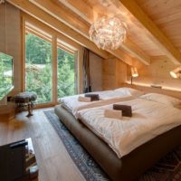 bedroom in a wooden house central lighting