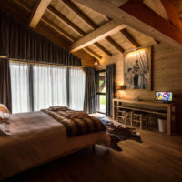 bedroom in a wooden house spotlights