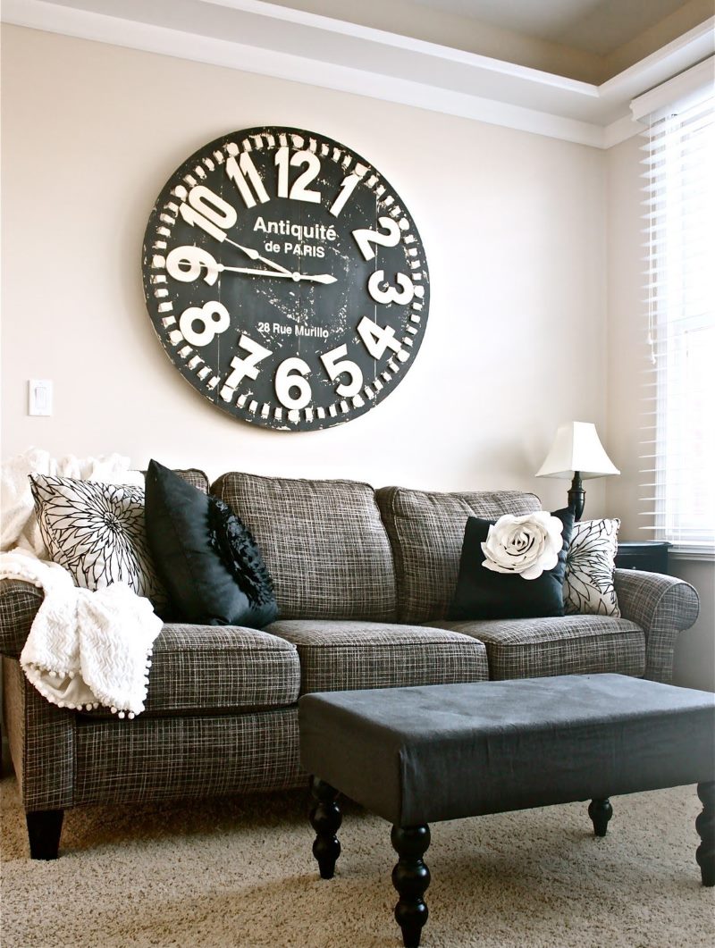 Large clock over the sofa in the living room