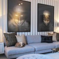 Masked faces in photos above the sofa