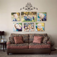 Family photos over the sofa in the living room