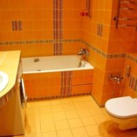 Photo of the interior of the combined bathroom in carrot shades
