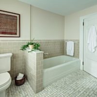 Separation of a combined bathroom into zones using a partition