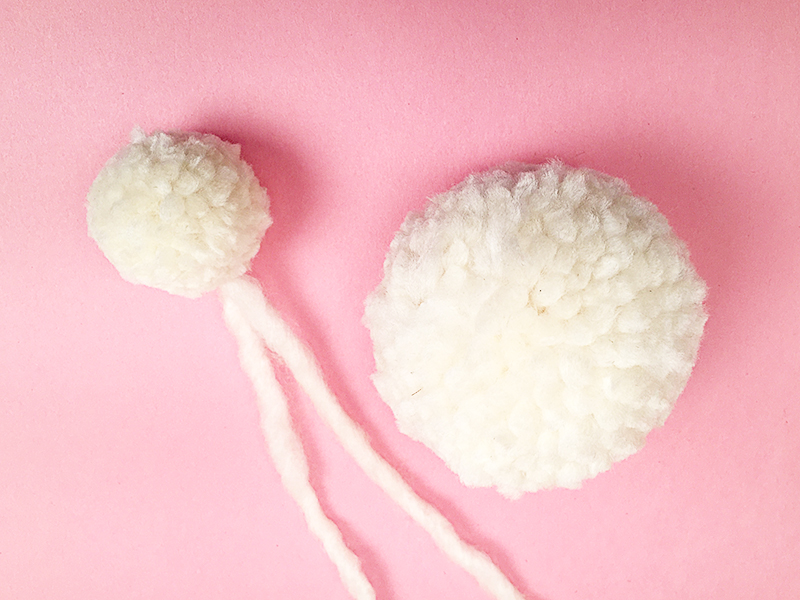 Two pompons for making an Easter bunny