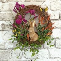 Easter wreath with a bunny on a brick wall