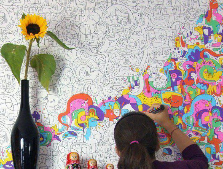 Girl paints wallpaper coloring in her room