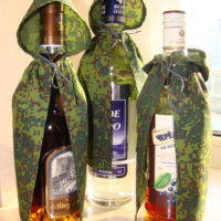 Bottles in camouflage cloak scarves as a gift