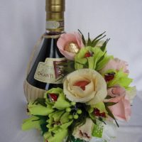 Beautiful bouquet with alcohol as a gift