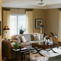 Beige curtains on a metal cornice in the living room