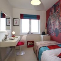 White walls and colored textiles in the design of the bedroom