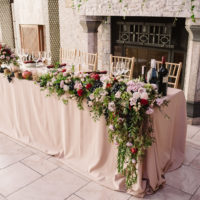 Wedding table on the background of the fireplace