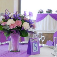 A plate with a number on the table for guests of a wedding celebration