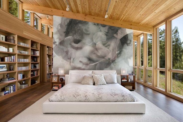 Murals with blurry effects in a bright bedroom with panoramic windows
