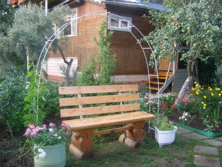 Home-made garden bench and light pergola