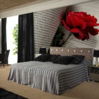 Wall mural with a huge rose on the bedroom wall