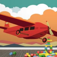 A print with an airplane on the wall of a children's bedroom