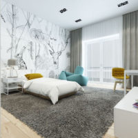 Spacious bedroom with wall murals on the wall