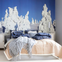 Snowy fir trees on the mural in the bedroom
