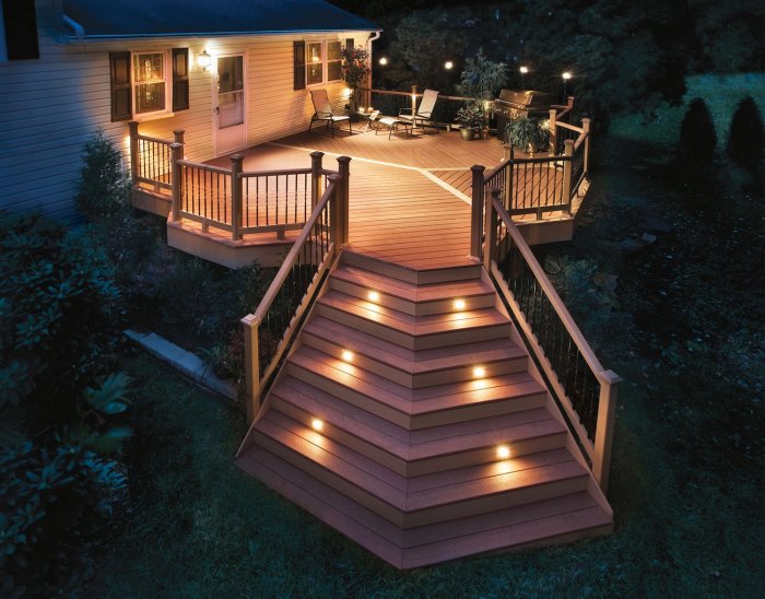 Photo of outdoor cottage terrace with lights on