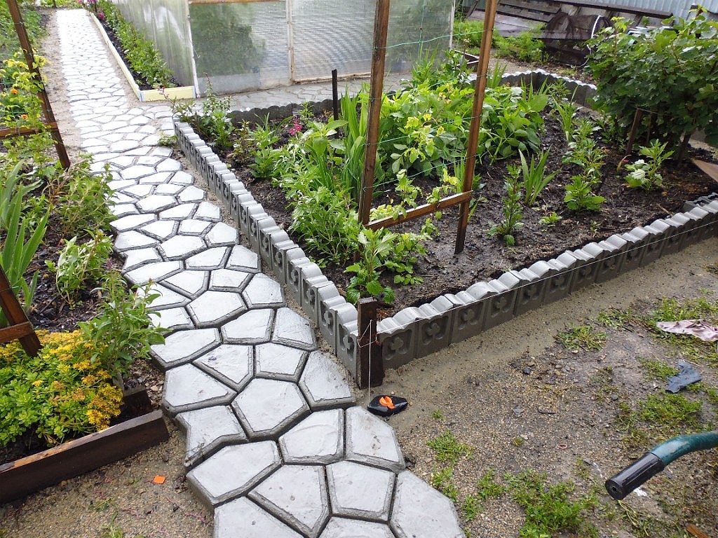 Homemade concrete tile garden path
