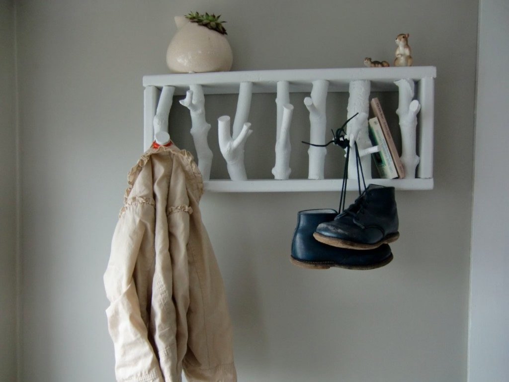 Homemade hanger made of twigs to decorate the wall