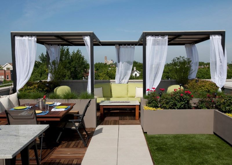 Gray steel gazebo on the roof of a residential building