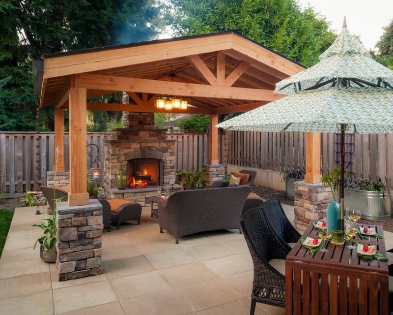 Outdoor gazebo with barbecue and seating area