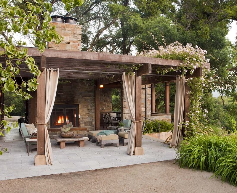 Gazebo with fireplace in the design of the country garden