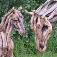 Sculptures of horses from old branches