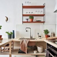 Open shelves in the decor of the kitchen space
