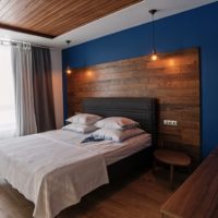 Brown laminate on blue bedroom wall