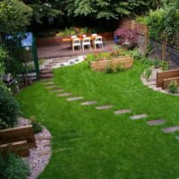 Winding step-by-step path through a green lawn