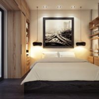 Headboard lighting in a studio apartment with a sconce